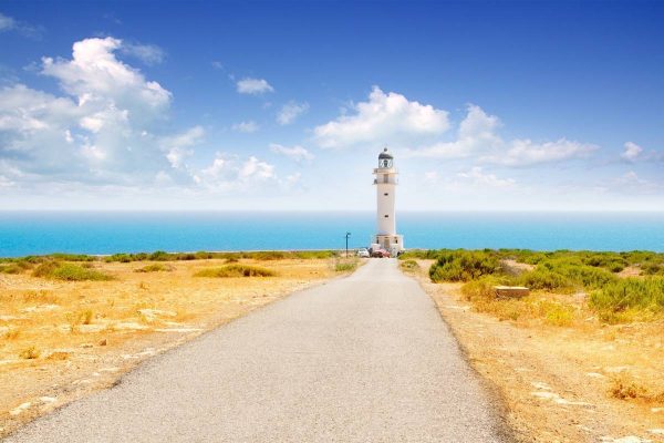 11058031 - barbaria cape lighthouse in formentera with road perspective